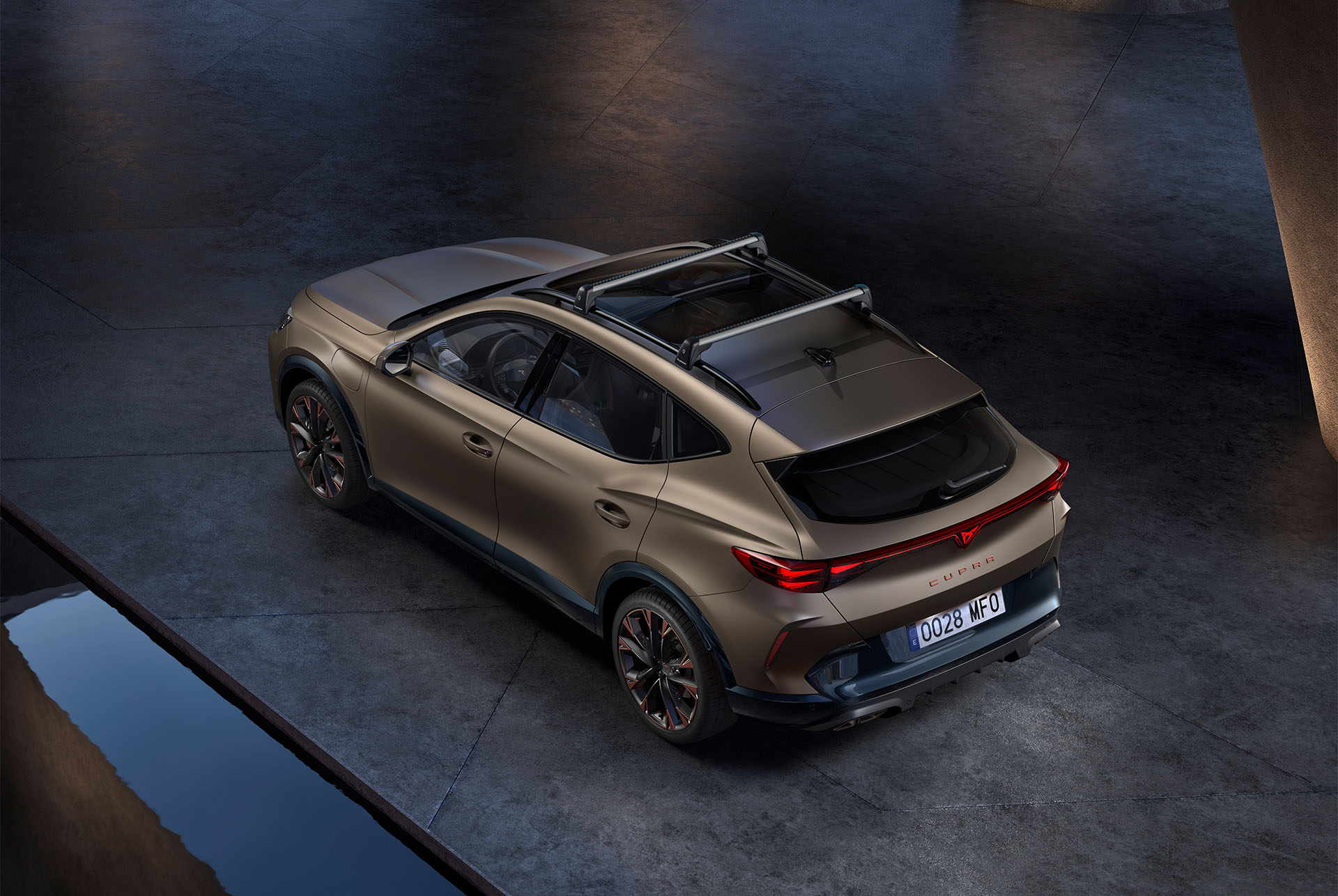 New century bonze matt CUPRA Formentor 2025 with car roof thule bike rack accessory. 